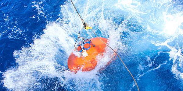 buoy being deployed in ocean